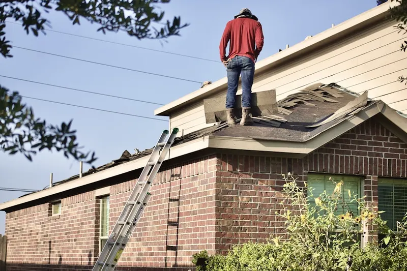 Professional roofer working on a residential roof in Mountainview
